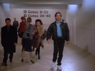 Elaine and Jerry rushing to the gate